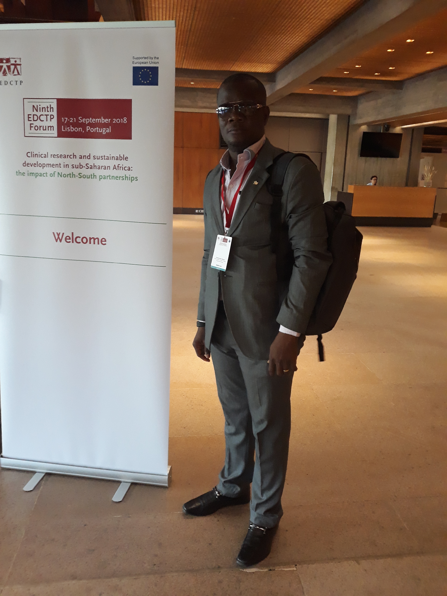 CRTN founding member at the Ninth EDCTP Forum welcome banner, Lisbon 2018